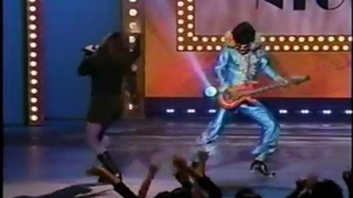 Screenshot of the "Sandman" and a performer at the Apollo